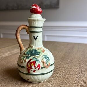 Antique ceramic vinegar jar with painted strawberry on vine